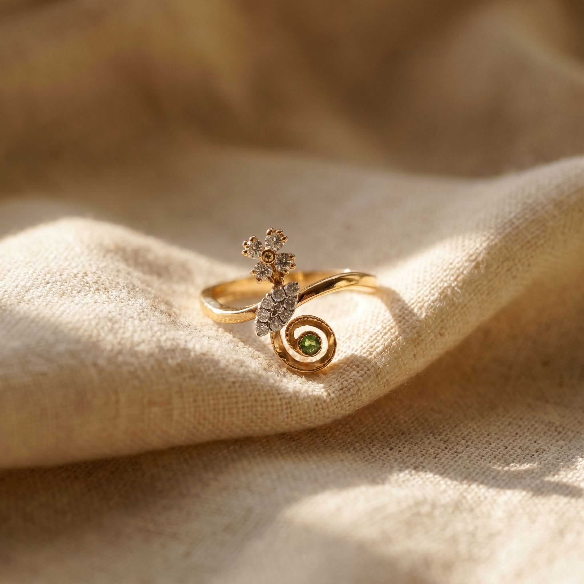 Green garnet spiral cocktail ring in 18K yellow gold, editorial scene on warm linen