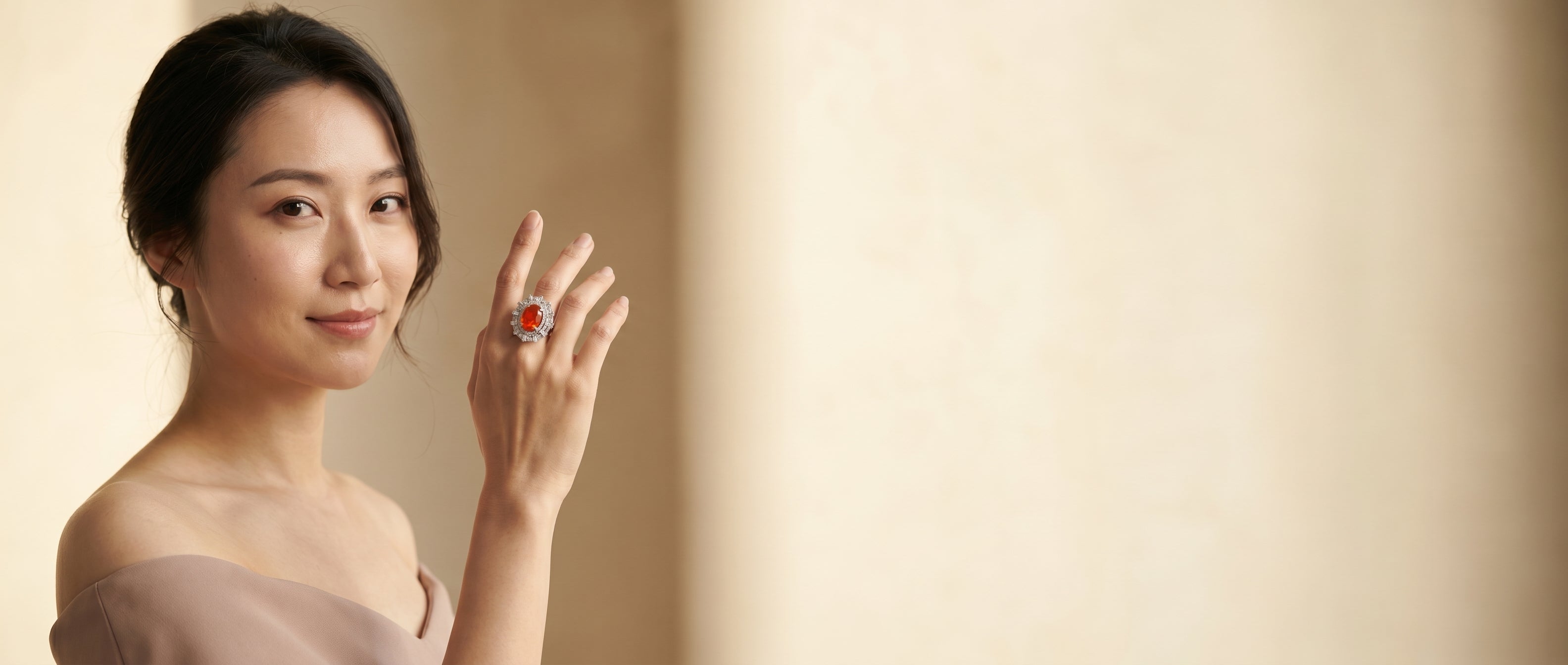 A woman wearing a fire opal cocktail ring